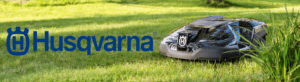 Husqvarna Robotic mower on grass with logo 