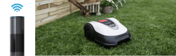 Honda miimo robotic mower on some grass with an amazon Alexa next to it 